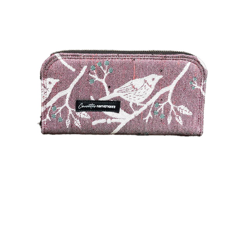 A zippered card and coin holder made with mauve and green bird-patterned babywearing wrap fabric.
