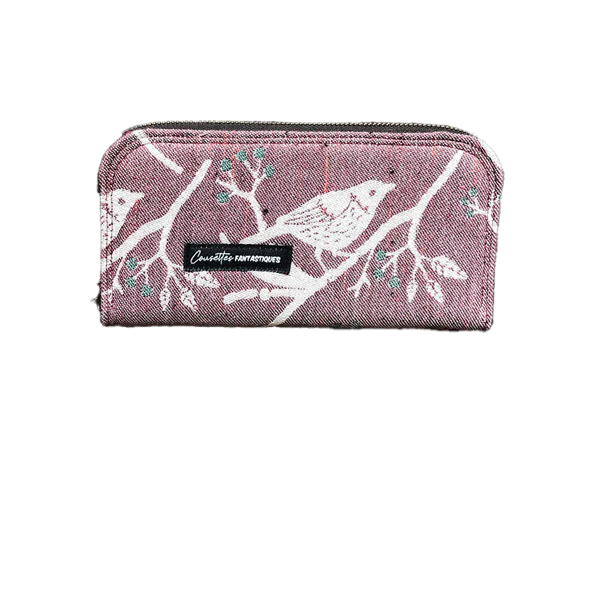 A zippered card and coin holder made with mauve and green bird-patterned babywearing wrap fabric.