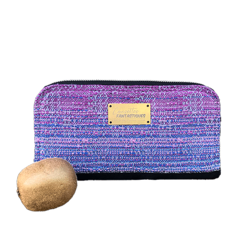 A cardholder and zippered coin purse made from a gradient mirror wrap from pink to blue and black cork.