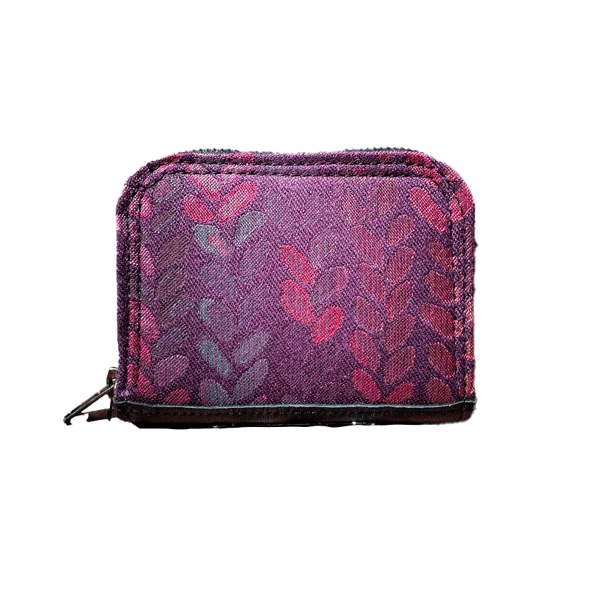 Un petit porte-cartes et porte-monnaie zippé réalisé en tissu dans des nuances de violet, prune, rose... avec un motif de gouttelettes, et en cuir d'agneau noir.