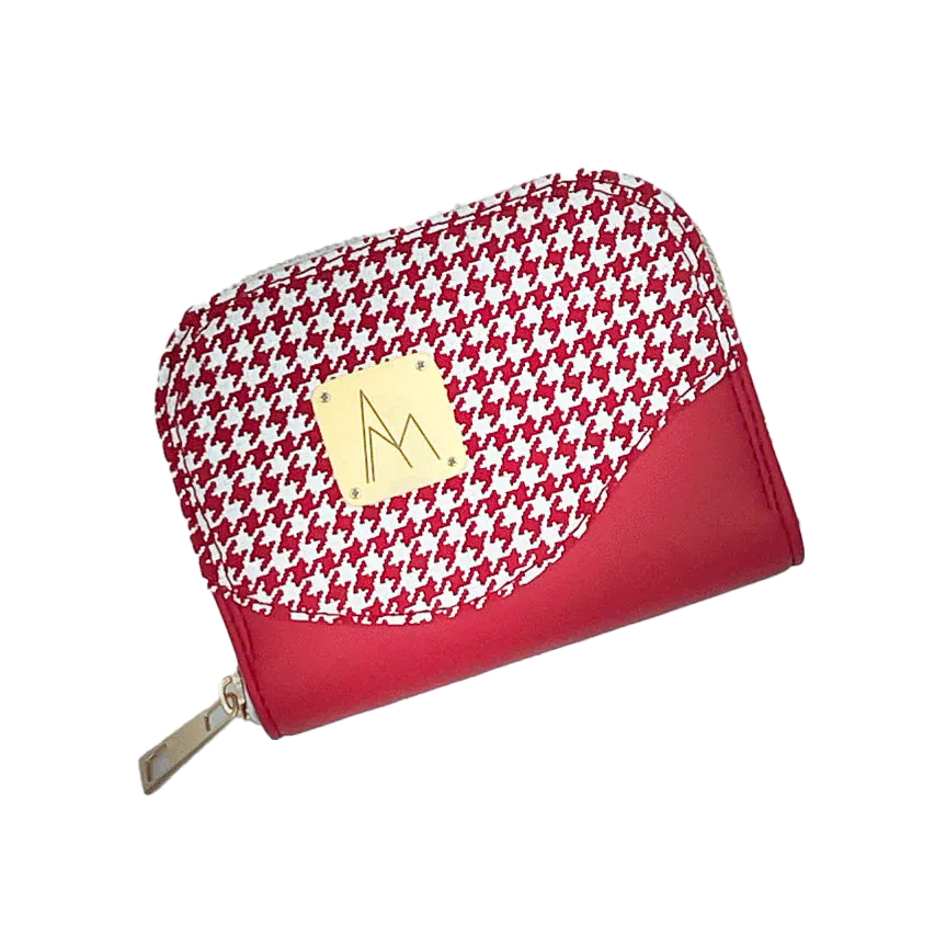 Un porte-cartes-et-monnaie zippé fabriqué à partir d'un cuir rouge et d'un cuir rouge imprimée pied de poule blanc, avec une doublure rouge siglée Sonia Rykiel.
