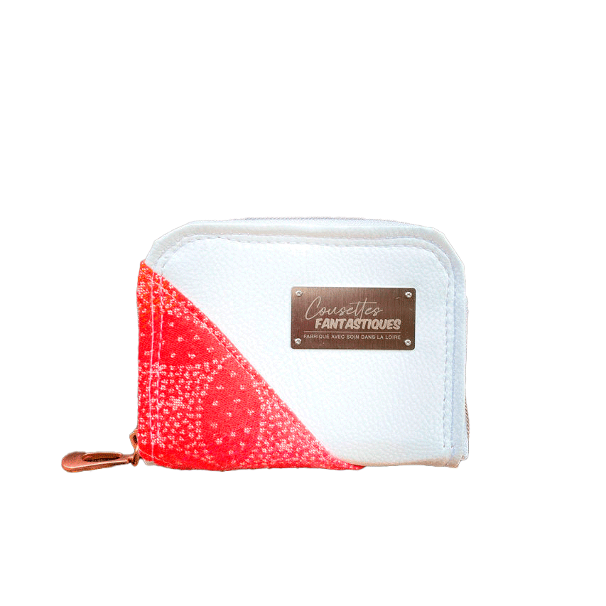 Un petit porte-cartes et monnaie zippé fait avec du tissu d'écharpe dégradé de jaune orangé à rose, au motif étoiles pointillistes, et du simili blanc.