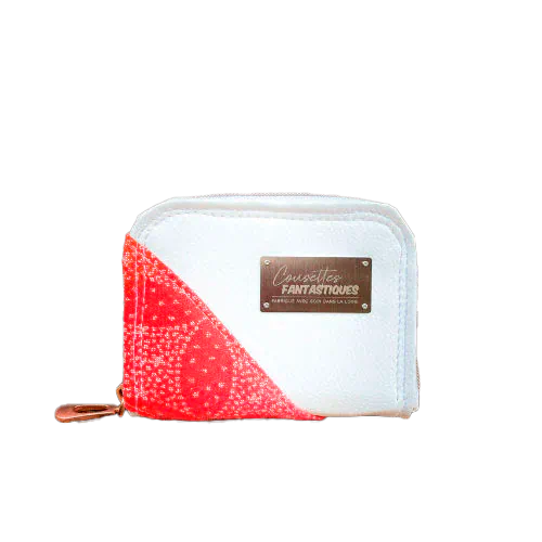 Un petit porte-cartes et monnaie zippé fait avec du tissu d'écharpe dégradé de jaune orangé à rose, au motif étoiles pointillistes, et du simili blanc.