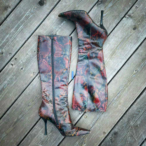 My pair of high-heeled boots, in red-dyed snakeskin leather.