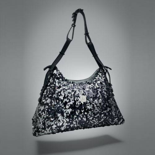 A large shoulder bag made from a black and silver sequin fabric, a grey couture denim, and a fine black faux leather.